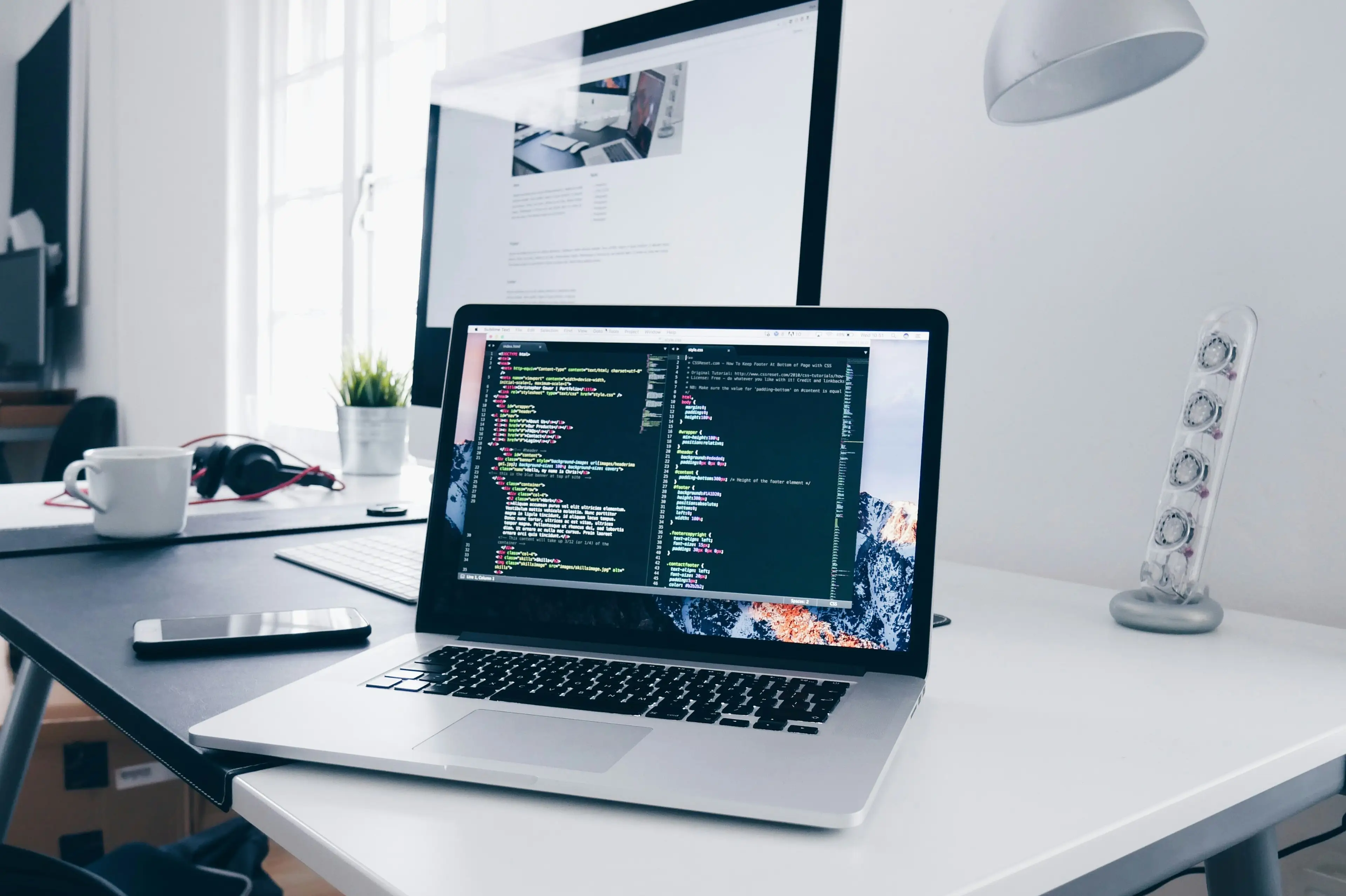 Modern Australian digital agency developer workstation running code and motion UI